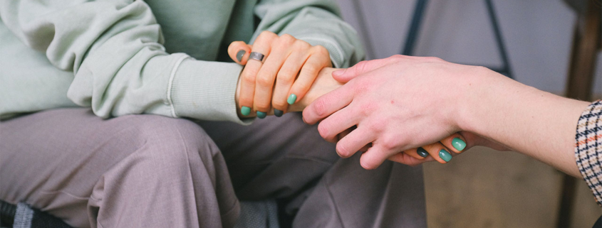 People holding hands.