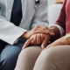 Doctor Holding a Patients Hand