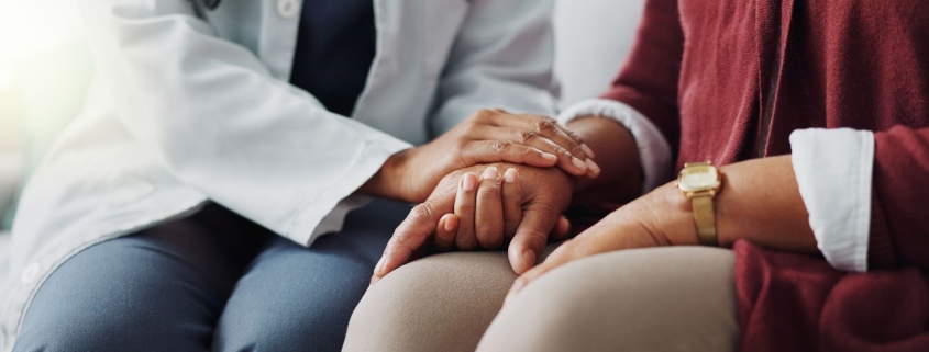 Doctor Holding a Patients Hand